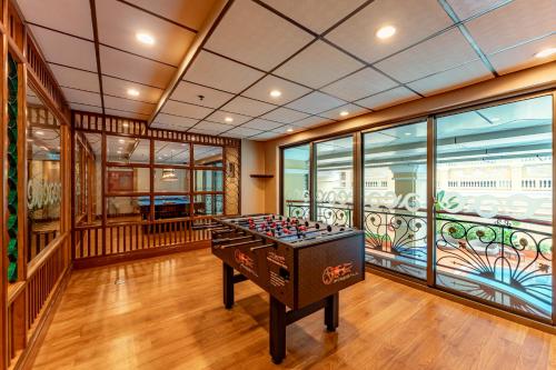 a room with a foosball table in the middle at Sherwood Residence in Ho Chi Minh City