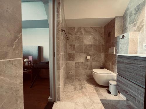 a bathroom with a toilet and a sink at Townhouse 't Raap in Amsterdam