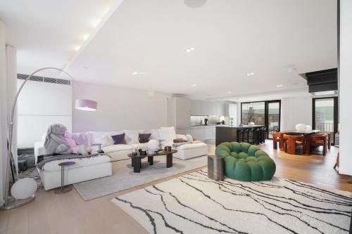 a living room with a couch and a table at Mayfair Residences in London