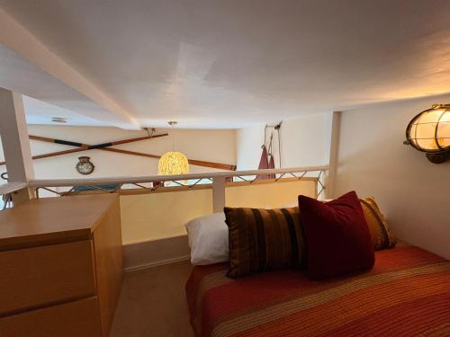 a bedroom with a bed and a dresser in a room at Zion Place in Dartmouth