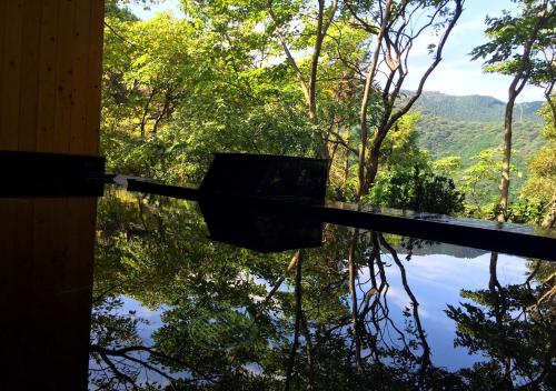 a view of a body of water from a house at LiVEMAX Resort Atami Forest in Atami