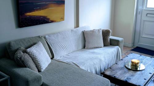 a living room with a couch and a coffee table at Apartment Wexford Crescent Mall in Wexford