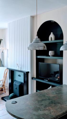 a living room with a table and a fireplace at Apartment Wexford Crescent Mall in Wexford