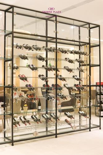 a display case for a shoe store with shoes at Crowne Plaza Pune City Centre by IHG in Pune