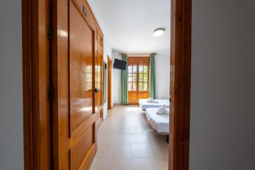 a hallway with two beds in a room at BF Rooms Garrucha in Garrucha
