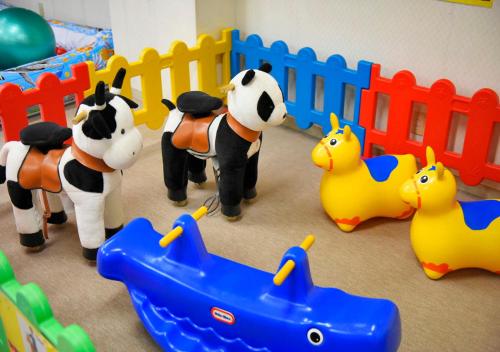 a group of toy cows and ducks in a crib at LiVEMAX Resort Atami Forest in Atami