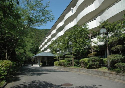 a building with a street in front of it at LiVEMAX Resort Atami Forest in Atami