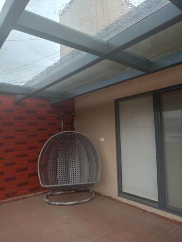 a room with a ceiling and a window and a building at Villa A1 in Pali