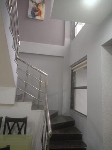 a staircase in a building with a stair case at Villa A1 in Pali