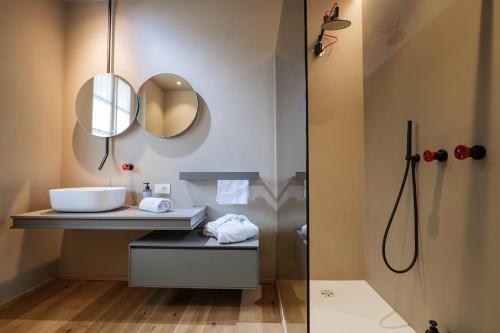 a bathroom with a sink and a mirror at Villa Amelia in Orta San Giulio