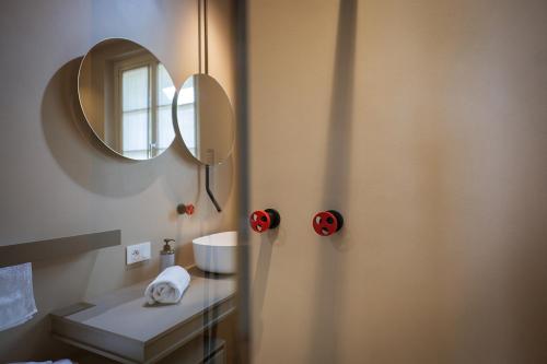 a bathroom with a sink and a mirror at Villa Amelia in Orta San Giulio