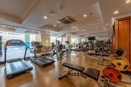 a gym with a lot of treadmills and machines at Sherwood Residence in Ho Chi Minh City