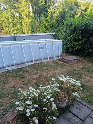 a garden with white flowers in a yard at Sweet Secret in Samobor