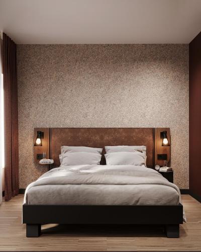 a bedroom with a large bed with a large headboard at Hota Hotel Porrentruy in Porrentruy