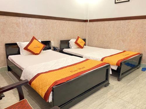 Postel nebo postele na pokoji v ubytování DONA hotel