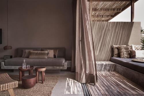 a living room with a couch and a table at Casa Cook El Gouna - Adults Only in Hurghada