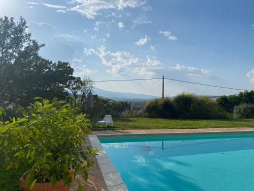 a swimming pool with a view of the mountains at Agriturismo Tenute di Hera - Via Francigena in Acquapendente