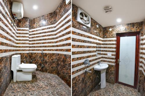 a bathroom with a toilet and a sink at FabExpress Jeet Stays - Near Dilshad Garden Metro Station in New Delhi