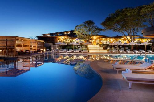 a resort with a pool at night at W Costa Rica Resort – Playa Conchal in Playa Conchal