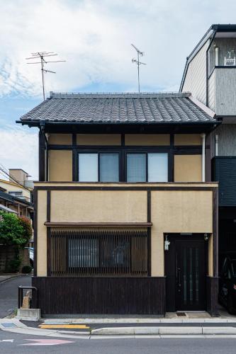 a building on the side of a street at 夏様小倉町 Convenient house, private house, 5-minute walk from Nijo station in Kyoto