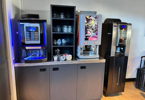 a video game counter with a video game machine at B&B HOTEL Le Havre Centre in Le Havre