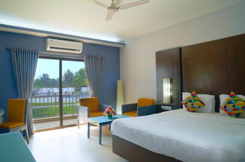Postel nebo postele na pokoji v ubytování Regenta Baywatch Resort, Goa