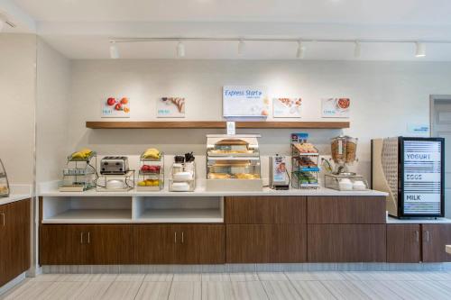 a counter in a store with food on it at Holiday Inn Express & Suites Chicago West - St Charles by IHG in Saint Charles