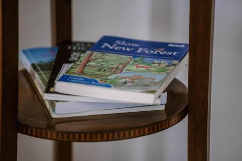 two books sitting on top of a table at Leygreen Farmhouse B&B in Beaulieu