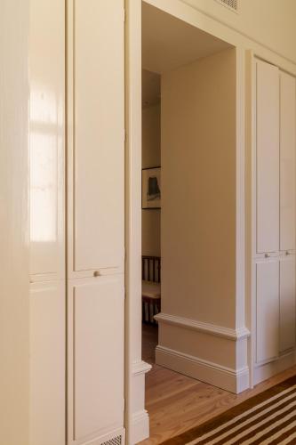 an empty room with a closet with white cabinets at Stockholm Stadshotell in Stockholm