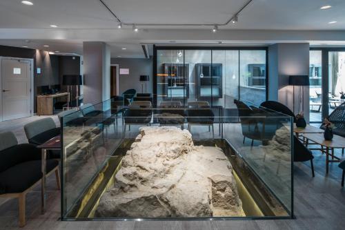 a museum with a skeleton of a fish in a glass case at Catalonia Magdalenes in Barcelona