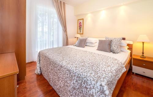 a bedroom with a large white bed with a window at Villa Palace Clara Apartment 2 island Krk by Vill in Malinska