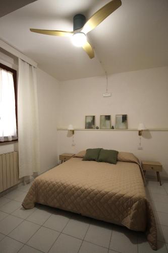 Ένα ή περισσότερα κρεβάτια σε δωμάτιο στο La Foresteria dell'Aia