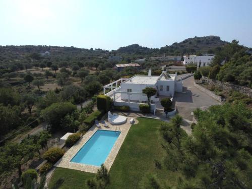 an aerial view of a villa with a swimming pool at Villa Paradisos Archangelos in Archangelos