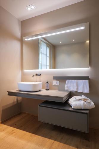 a bathroom with a sink and a mirror at Villa Amelia in Orta San Giulio