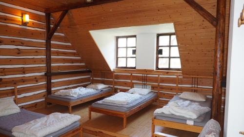 Кровать или кровати в номере Holiday House Malá Skála
