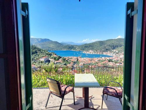 a view of a table and chairs from a window at SERENITY Apartments 1 in Vathi, Ithaka