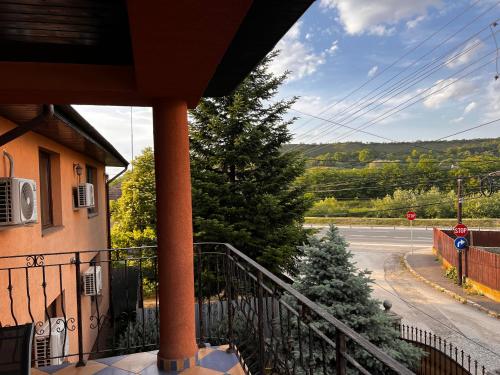a balcony of a house with a view of a street at Vila Ovi Salin in Turda