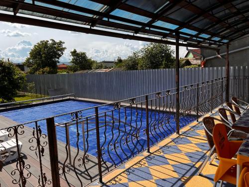 a swimming pool on the balcony of a house at Vila Ovi Salin in Turda