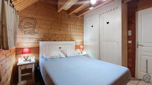 Ένα ή περισσότερα κρεβάτια σε δωμάτιο στο Chalet Puy Jumel
