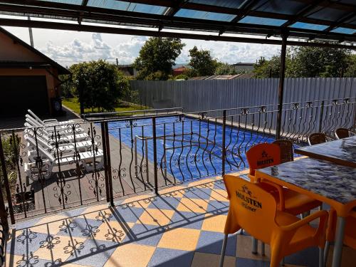 a balcony with a view of a swimming pool at Vila Ovi Salin in Turda