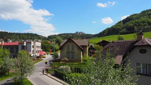 a small town with houses and a mountain at Holiday House Malá Skála in Malá Skála