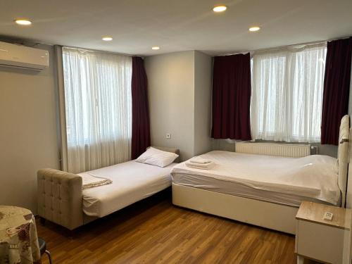 Postel nebo postele na pokoji v ubytování Kaman Home Apart