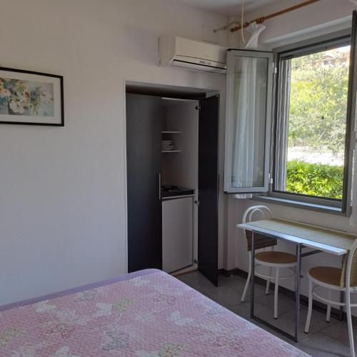 Ένα ή περισσότερα κρεβάτια σε δωμάτιο στο Residence Castiglione