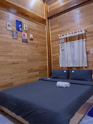 Postel nebo postele na pokoji v ubytování Nhà Nghỉ Huyền Măng Đen