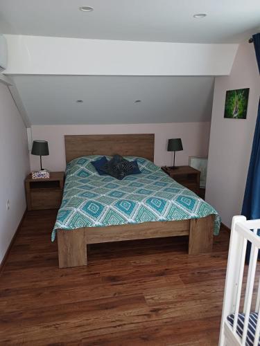 a bedroom with a bed and two night stands at Villa Villekulla in Chukovezer