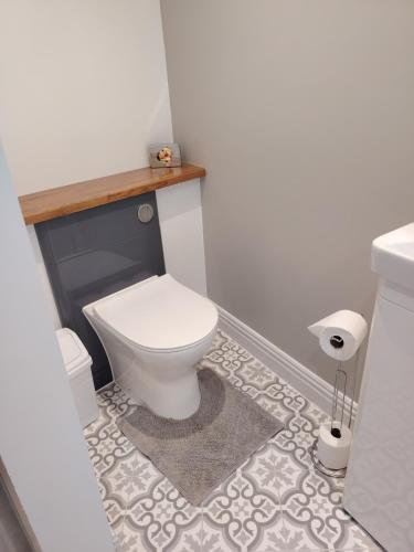 a bathroom with a white toilet and a sink at The Wheatsheaf in Salisbury