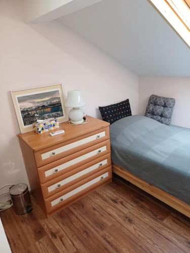 a bedroom with a bed and a dresser at Villa Villekulla in Chukovezer