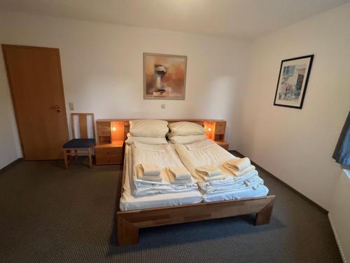 a bedroom with a bed with pillows on it at Fewo 3 in Willingen