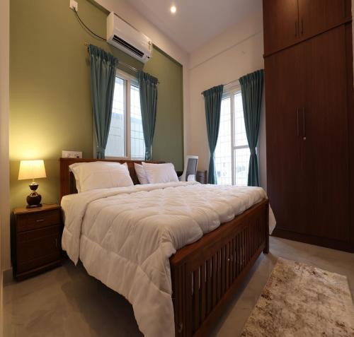 Katil atau katil-katil dalam bilik di Olivette Suites
