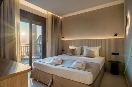 A bed or beds in a room at Hotel Areti